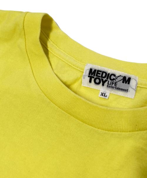 MEDICOM TOY LIFE ENTERTAINMENT（メディコムトイ・ライフエンターテイメント）MEDICOM TOY LIFE ENTERTAINMENT (メディコムトイ・ライフエンターテイメント) プリントTシャツ イエロー×ブラック サイズ:XLの古着・服飾アイテム