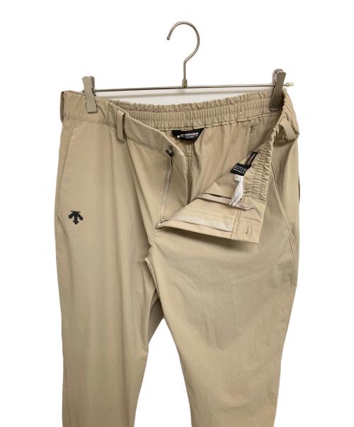 DESCENTE ALLTERRAIN（デザイント オルテライン）DESCENTE ALLTERRAIN (デザイント オルテライン) コーデュラストレッチレギュラーパンツ ベージュ サイズ:Oの古着・服飾アイテム