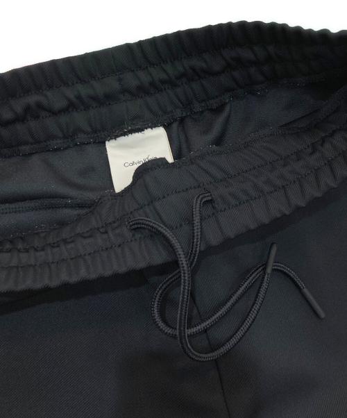 Calvin Klein（カルバンクライン）Calvin Klein (カルバンクライン) ストレッチ ツイルトラック パンツ　40EM251 ブラック サイズ:XSの古着・服飾アイテム