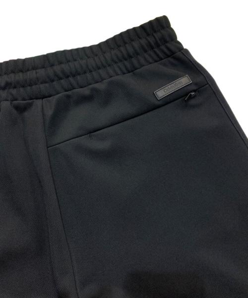 Calvin Klein（カルバンクライン）Calvin Klein (カルバンクライン) ストレッチ ツイルトラック パンツ　40EM251 ブラック サイズ:XSの古着・服飾アイテム
