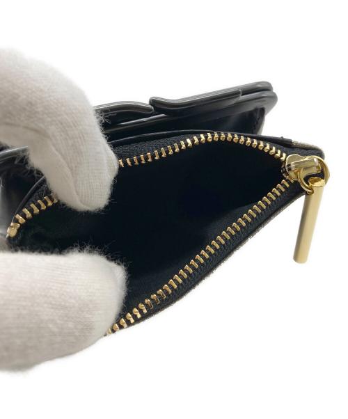 pomtata（ポンタタ）pomtata (ポンタタ) 2つ折り財布 ブラック×シルバーの古着・服飾アイテム