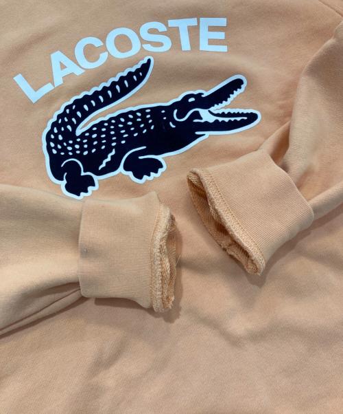 LACOSTE（ラコステ）LACOSTE (ラコステ) ビッグクロックカレッジロゴクルーネックスウェット トレーナー　SH9689 オレンジ サイズ:3の古着・服飾アイテム