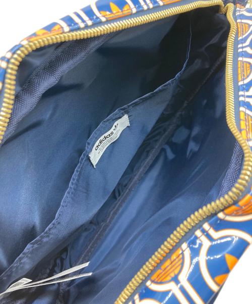 adidas Originals（アディダスオリジナル）adidas originals (アディダスオリジナル) モノグラムプリント エアライナーバッグ ネイビー×オレンジの古着・服飾アイテム