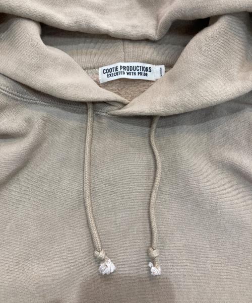 COOTIE PRODUCTIONS（クーティープロダクツ）COOTIE PRODUCTIONS (クーティープロダクツ) プリントプルオーバーパーカー ベージュ サイズ:Lの古着・服飾アイテム