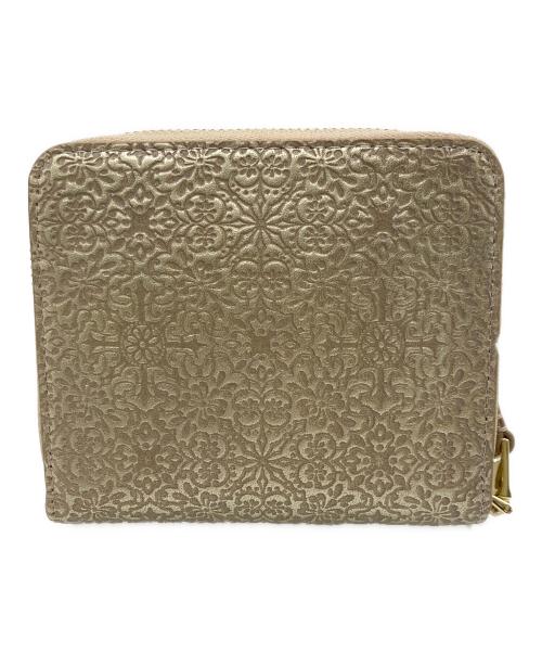 TREASURE TOPKAPI（トレジャートプカピ）TREASURE TOPKAPI (トレジャートプカピ) エンボスレザー ラウンド二つ折り財布 ゴールドの古着・服飾アイテム