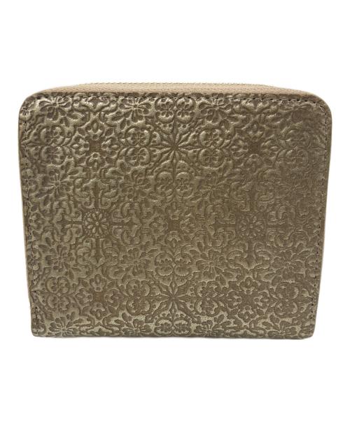 TREASURE TOPKAPI（トレジャートプカピ）TREASURE TOPKAPI (トレジャートプカピ) エンボスレザー ラウンド二つ折り財布 ゴールドの古着・服飾アイテム