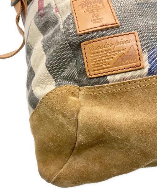 stussy（ステューシー）stussy (ステューシー) master-piece (マスターピース) コラボキャンバスバックパック ブラウンの古着・服飾アイテム