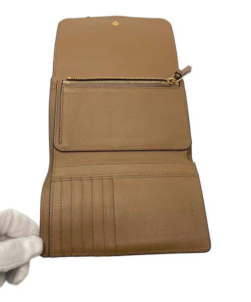 Chloe（クロエ）Chloe (クロエ) チャーム付き 3つ折り財布 ブラウンの古着・服飾アイテム