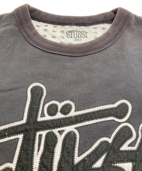 stussy（ステューシー）stussy (ステューシー) ワッペンクルーネックスウェット ブラック サイズ:Lの古着・服飾アイテム