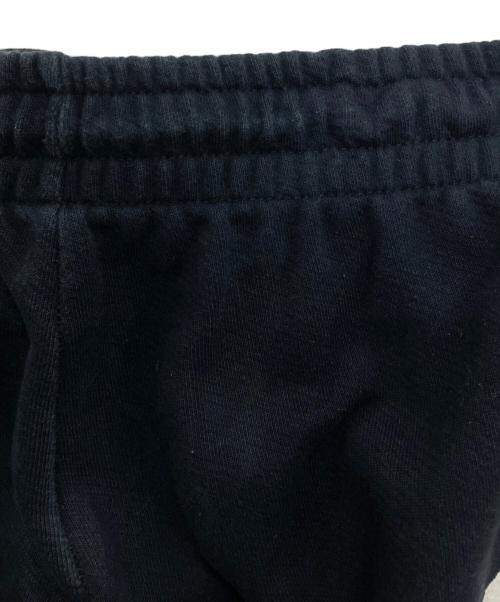 Denim Tears（デニムティアーズ）Denim Tears (デニムティアーズ) リースプリント トラックパンツ ブラック サイズ:XXLの古着・服飾アイテム