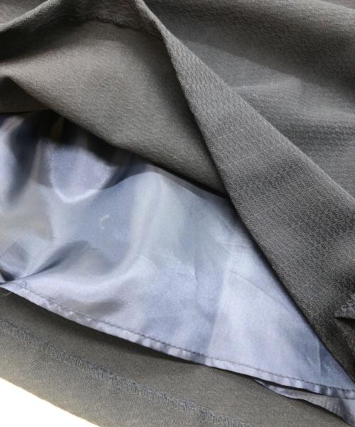 Jolie mignon（ジョリ―ミニョン）Jolie mignon (ジョリ―ミニョン) ポケットリボン付き ジャガードワンピース ネイビー サイズ:38の古着・服飾アイテム