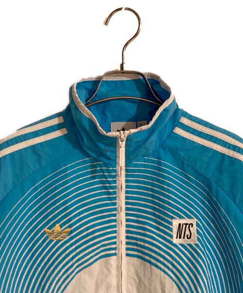adidas（アディダス）adidas (アディダス) NTS Radio (NTSラジオ) Allover Print SST Track Top/ スカイブルー サイズ:Mの古着・服飾アイテム