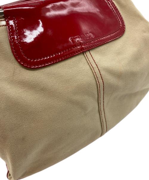 PRADA（プラダ）PRADA (プラダ) BEIGE CANVAS METAL LOOP TOTE BAG レッドの古着・服飾アイテム