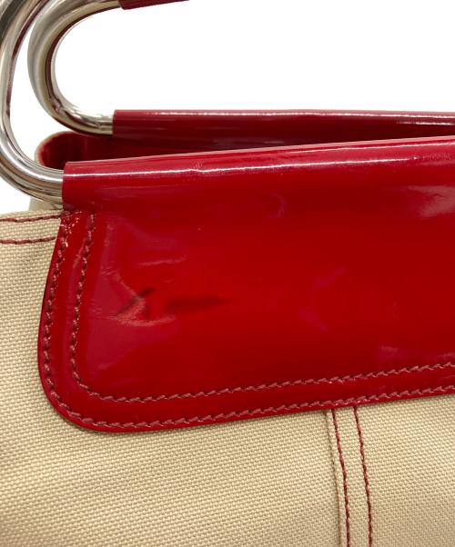 PRADA（プラダ）PRADA (プラダ) BEIGE CANVAS METAL LOOP TOTE BAG レッドの古着・服飾アイテム