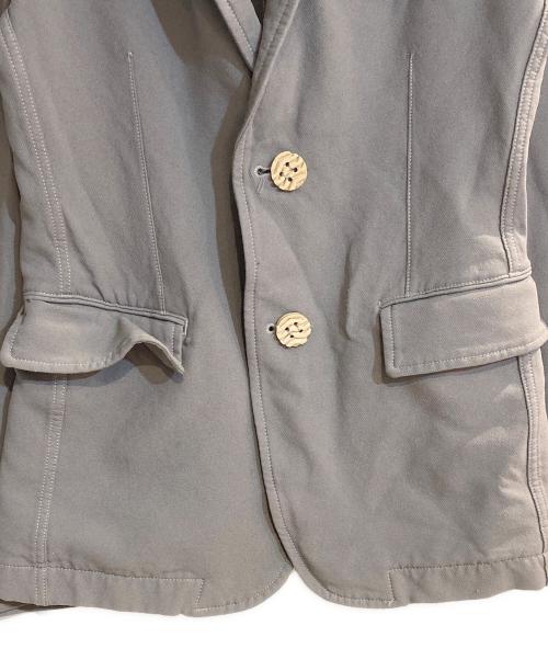 COMME des GARCONS HOMME PLUS（コムデギャルソンオムプリュス）COMME des GARCONS HOMME PLUS (コムデギャルソンオムプリュス) タイヤボタンポリ縮テーラードジャケット グレー サイズ:Sの古着・服飾アイテム