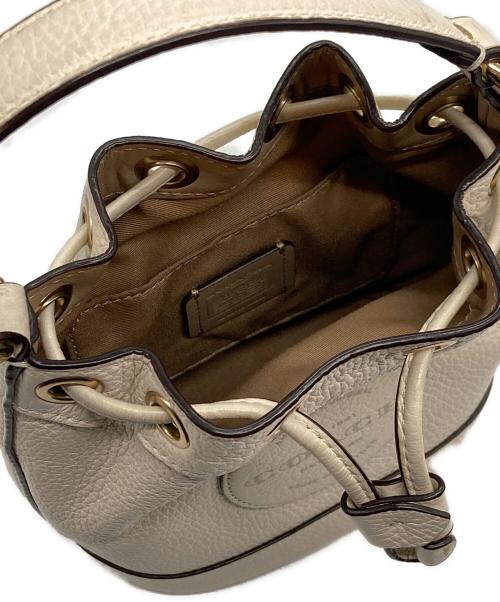 COACH（コーチ）COACH (コーチ) レザーデンプシードローストリングバケットバッグ ベージュの古着・服飾アイテム