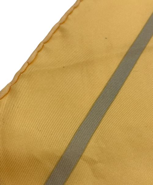 HERMES（エルメス）HERMES (エルメス) リボン柄シルクスカーフ イエローの古着・服飾アイテム