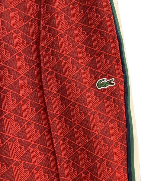 LACOSTE（ラコステ）LACOSTE (ラコステ) サイドテーピングモノグラムジャカードトラックパンツ レッド サイズ:Sの古着・服飾アイテム