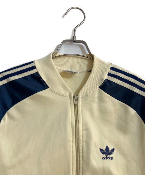 adidas（アディダス）adidas (アディダス) トラックジャケット クリームホワイト×ネイビー サイズ:Mの古着・服飾アイテム