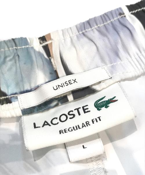 LACOSTE（ラコステ）LACOSTE (ラコステ) 総柄転写プリントトラックパンツ マルチカラー サイズ:Lの古着・服飾アイテム