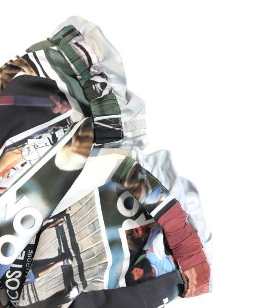 LACOSTE（ラコステ）LACOSTE (ラコステ) 総柄転写プリントトラックパンツ マルチカラー サイズ:Lの古着・服飾アイテム