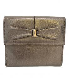 Salvatore Ferragamo（サルヴァトーレ フェラガモ）の古着「レザー二つ折り財布」｜シルバー