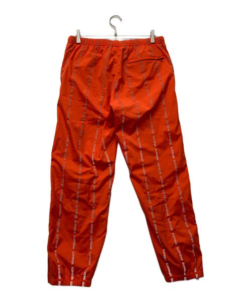 SUPREME（シュプリーム）Supreme (シュプリーム) Reflective Text Track Pant オレンジ サイズ:Mの古着・服飾アイテム