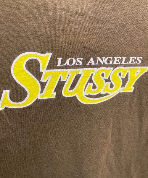 stussy（ステューシー）stussy (ステューシー) ロゴプリントTシャツ ブラウン サイズ:Ｍの古着・服飾アイテム