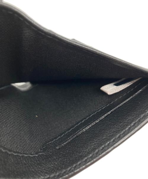 JIMMY CHOO（ジミーチュウ）JIMMY CHOO (ジミーチュウ) クリスタルスタースタッズ 二つ折り財布 ブラックの古着・服飾アイテム