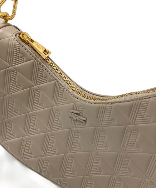 LACOSTE（ラコステ）LACOSTE (ラコステ) ハーフムーンショルダーバッグ ベージュの古着・服飾アイテム