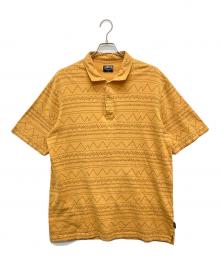 stussy（ステューシー）の古着「ネイティブパターンポロシャツ」｜イエロー