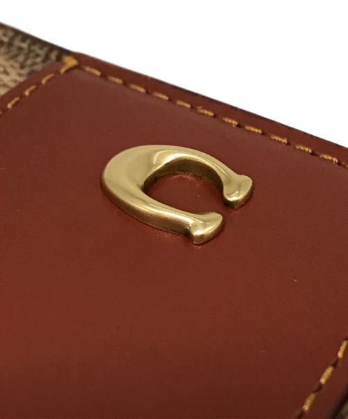 COACH（コーチ）COACH (コーチ) バイフォールド スナップ ウォレット ブラウンの古着・服飾アイテム
