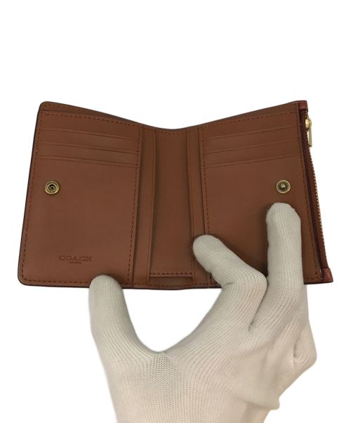 COACH（コーチ）COACH (コーチ) バイフォールド スナップ ウォレット ブラウンの古着・服飾アイテム