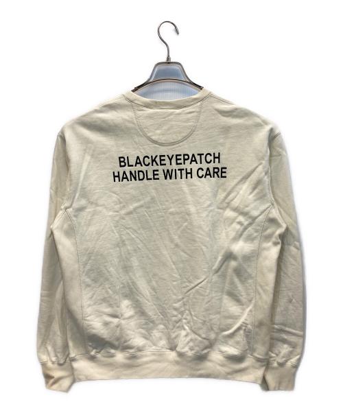 THE BLACK EYE PATCH（ブラックアイパッチ）THE BLACK EYE PATCH (ブラックアイパッチ) HANDLE WITH CARE CREW SWEAT アイボリー サイズ:Lの古着・服飾アイテム