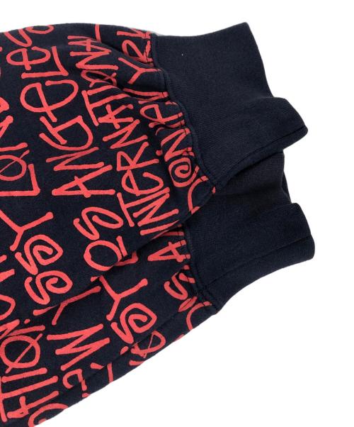 stussy（ステューシー）stussy (ステューシー) ワールドツアー総柄ロゴパーカー レッド×ネイビー サイズ:Ⅿの古着・服飾アイテム
