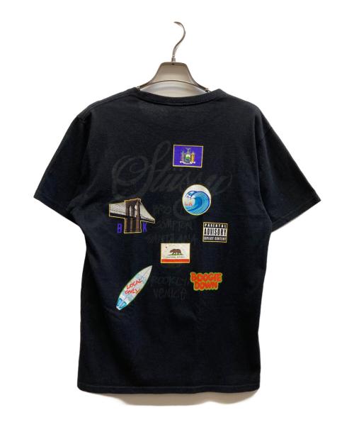 stussy（ステューシー）stussy (ステューシー) 国旗プリントTシャツ ブラック サイズ:Mの古着・服飾アイテム