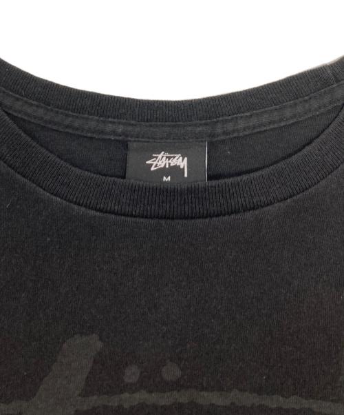 stussy（ステューシー）stussy (ステューシー) 国旗プリントTシャツ ブラック サイズ:Mの古着・服飾アイテム