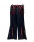 TRIPP NYC（トリップニューヨークシティー）の古着「bondage pants」｜レッド×ブラック