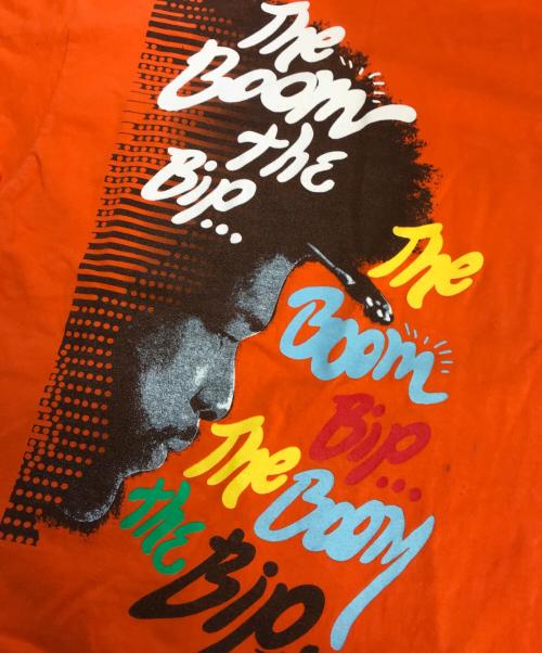 バンドTシャツ（バンドTシャツ）バンドTシャツ (バンドTシャツ) 00s ROOTS(ルーツ) バンドTシャツ オレンジ サイズ:Ｌの古着・服飾アイテム