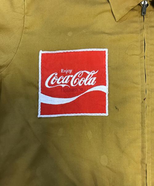 Coca Cola（コカコーラ）Coca Cola (コカコーラ) ジップアップジャケット マスタード サイズ:Ｍの古着・服飾アイテム