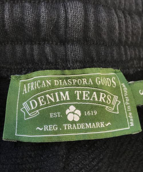 Denim Tears（デニムティアーズ）Denim Tears (デニムティアーズ) Cotton Wreath-print track pants ブラック サイズ:Ｓの古着・服飾アイテム