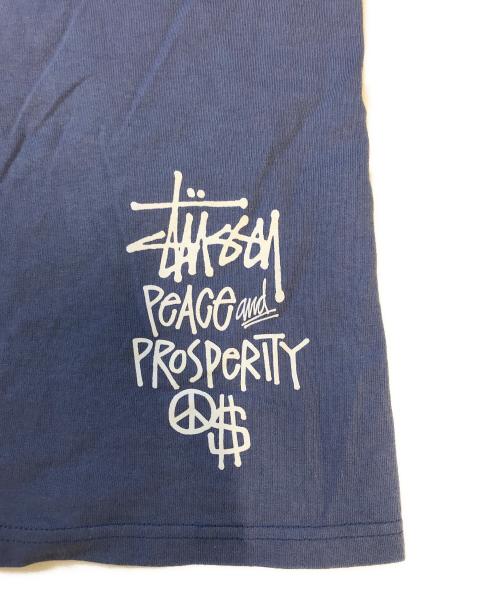 stussy（ステューシー）stussy (ステューシー) PEACE PROSPERITY Tee ネイビー サイズ:XLの古着・服飾アイテム