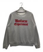 uniform experimentユニフォームエクスペリメント）の古着「GOTHIC LOGO CREWNECK SWEAT」｜グレー