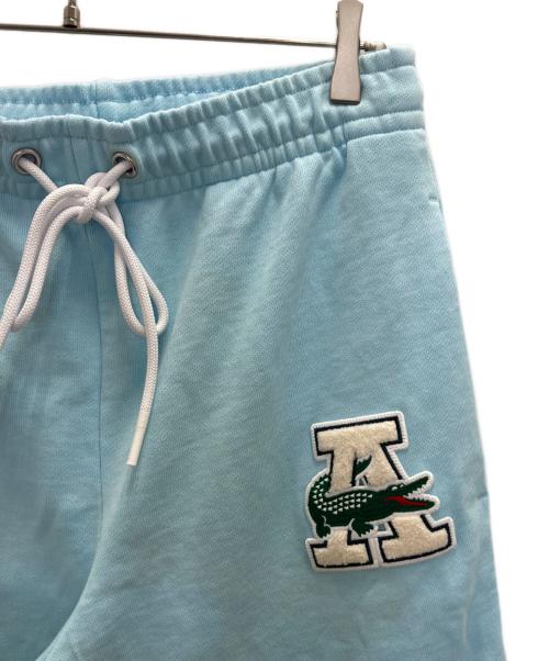 AWAKE（アウェイク）AWAKE (アウェイク) LACOSTE (ラコステ) NY スウェットトラックパンツ スカイブルー サイズ:SIZE Mの古着・服飾アイテム