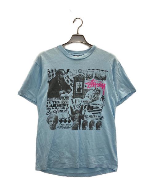 stussy（ステューシー）stussy (ステューシー) プリントTシャツ スカイブルー サイズ:Mの古着・服飾アイテム