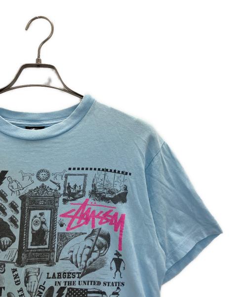 stussy（ステューシー）stussy (ステューシー) プリントTシャツ スカイブルー サイズ:Mの古着・服飾アイテム