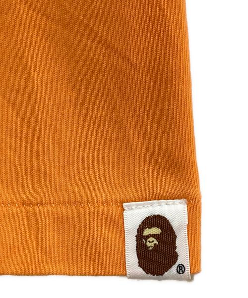 A BATHING APE（アベイシングエイプ）A BATHING APE (ア ベイシング エイプ) プリントカットソー オレンジ サイズ:Lの古着・服飾アイテム