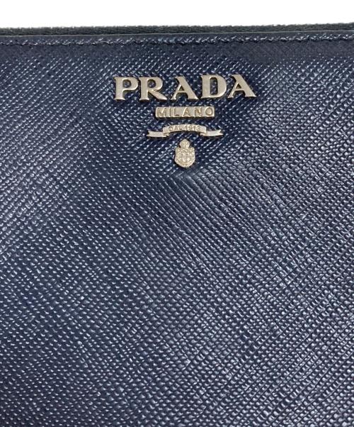 PRADA（プラダ）PRADA (プラダ) サフィアーノ メタルロゴ ラウンドジッフウォレット ネイビーの古着・服飾アイテム