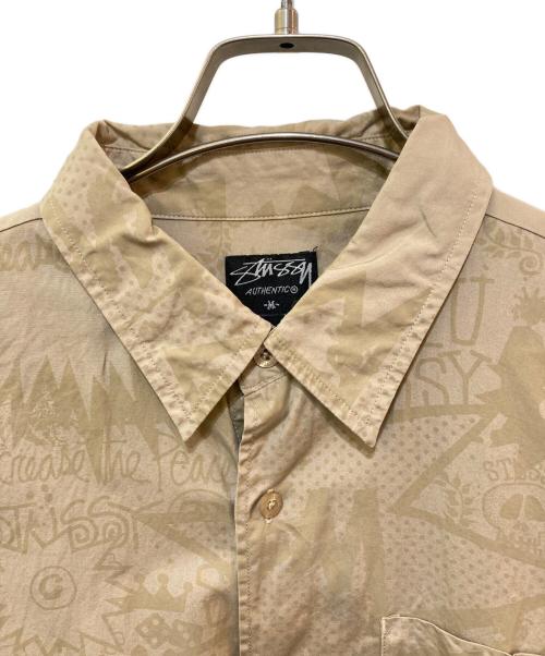 stussy（ステューシー）stussy (ステューシー) コミックプリントシャツ ベージュ サイズ:Mの古着・服飾アイテム