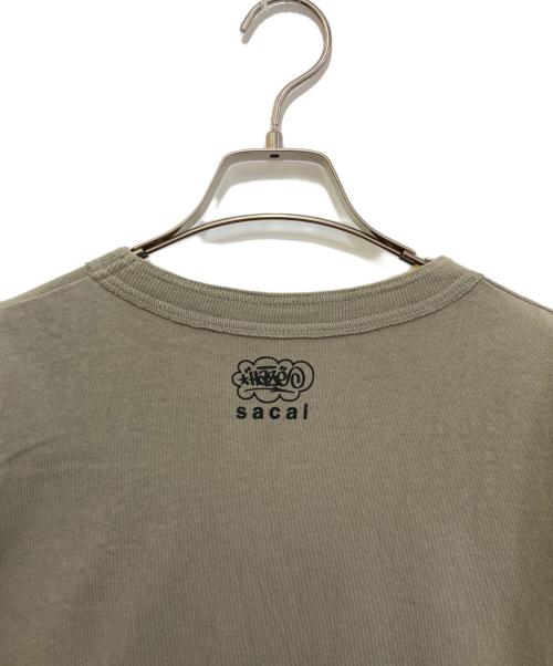 sacai（サカイ）sacai (サカイ) eric haze (エリック・ヘイズ) AS ONE T-Shirt　23-0465S オリーブ サイズ:3の古着・服飾アイテム